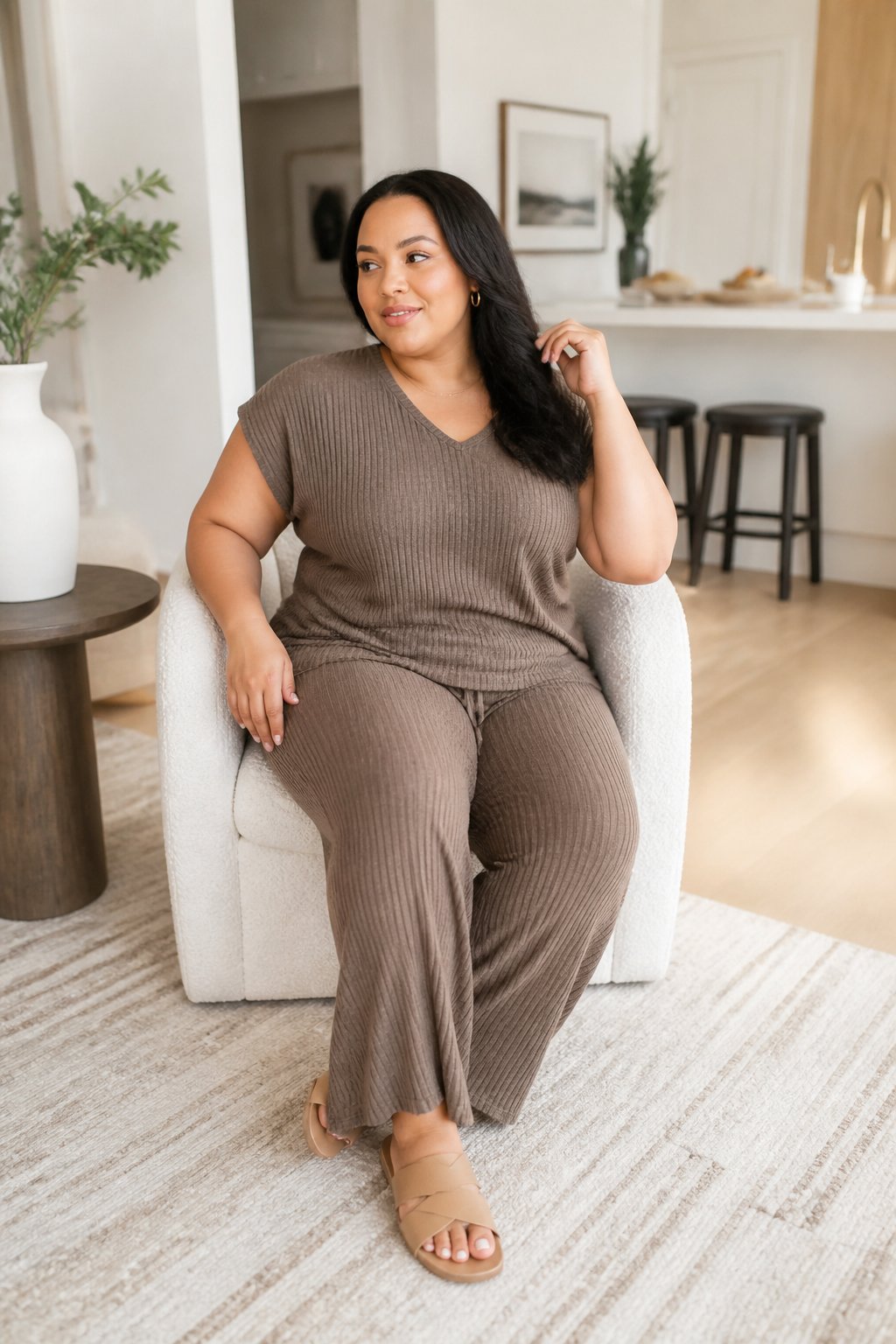 Midsize woman wearing a matching knit set and slides for a casual outfit