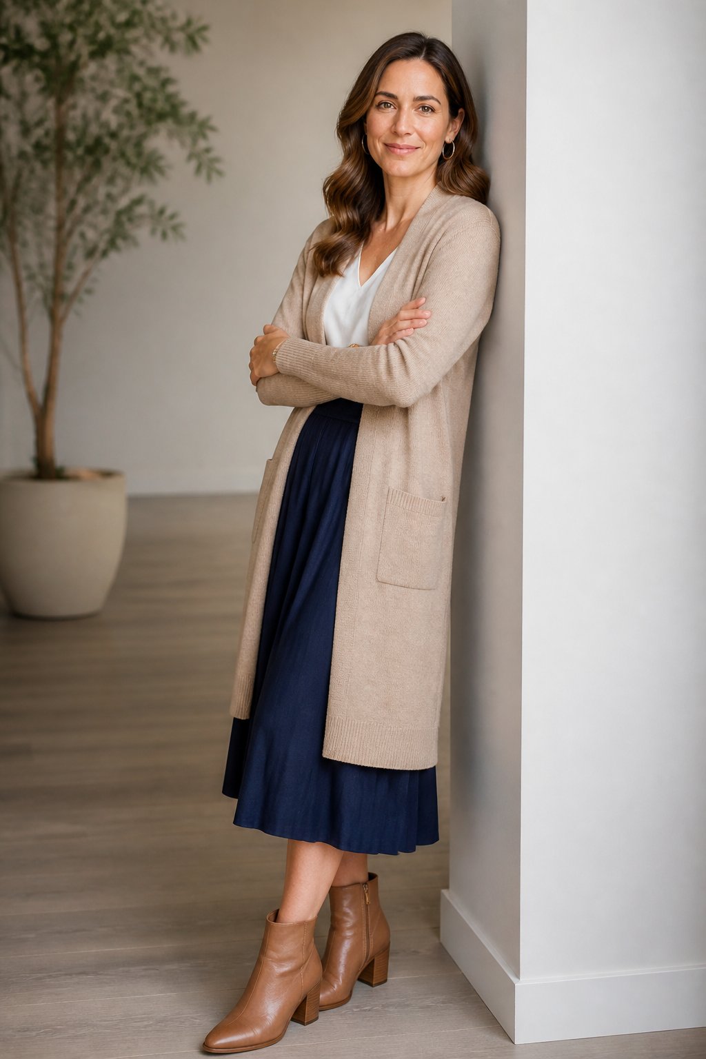 Woman wearing cardigan with midi skirt and ankle boots